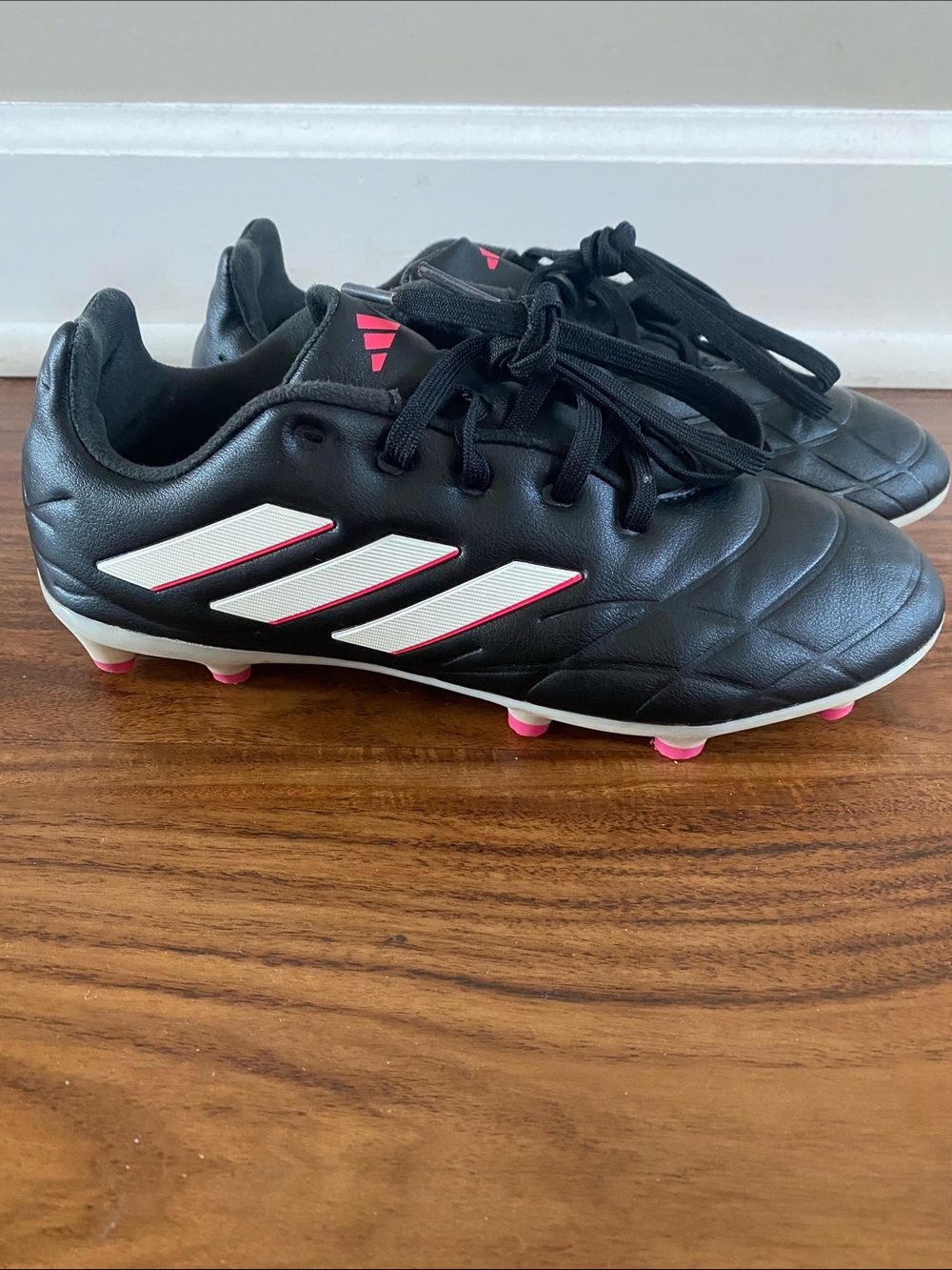 adidas Kids Black Soccer Cleats with White Stripes and Pink Accents